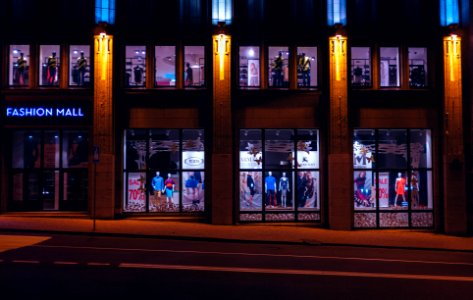 brown Fashion Mall store front photo at nighttime photo
