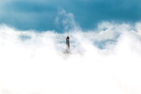 gray statue covered in white clouds