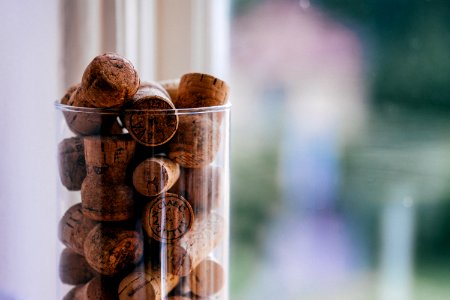 brown cork lot on glass container photo