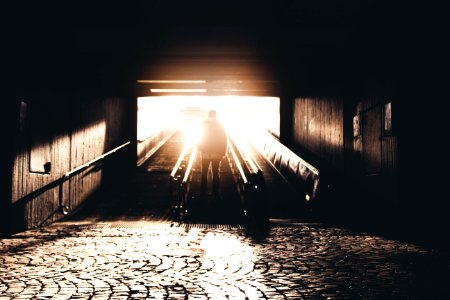 silhouette of man standing in staircase photo