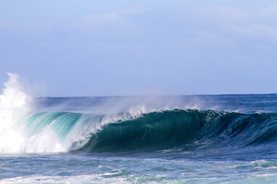 sea wave under gray clouds at daytime photo