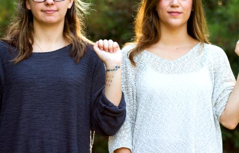 woman showing her wrist with tattoo photo