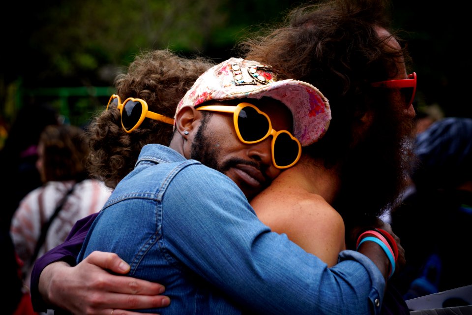 man hugging other man's back