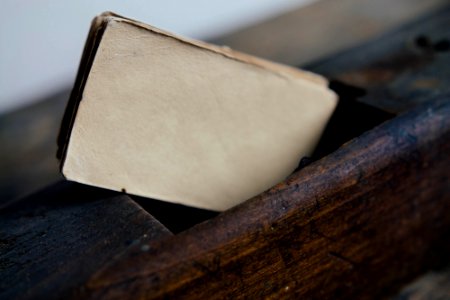 brown cards on brown wooden surface closeup photography photo