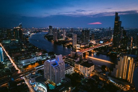 aerial photography of buildings near body of water during night photo