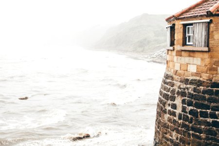 high-angle view of lighthouse beside body of water