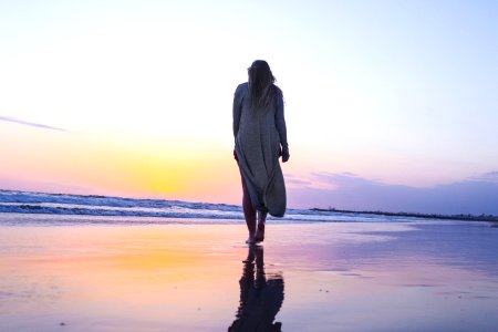 woman standing on beachfront photo