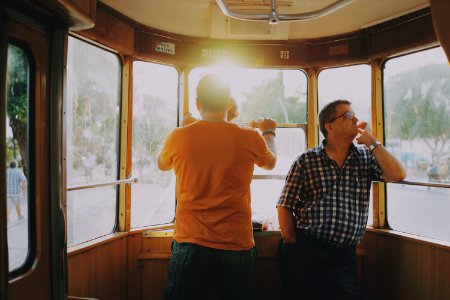men standing inside of train