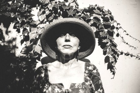 grayscale photo of woman wearing hat photo