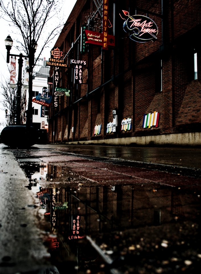 brown brick building with signages photo