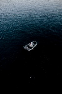 man in gray canoe boat