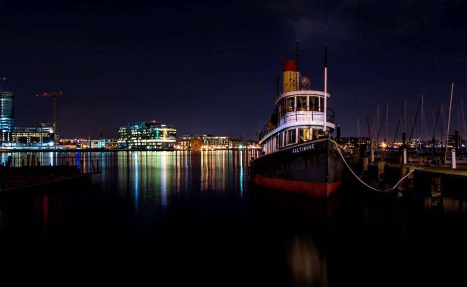 black boat tied on beach dock