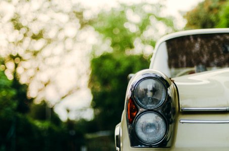 selective focus photography of vehicle headlight photo