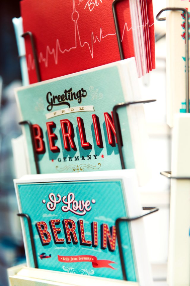 shallow focus photography of greeting cards on rack
