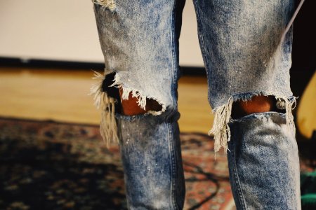 person standing on floral area rug photo