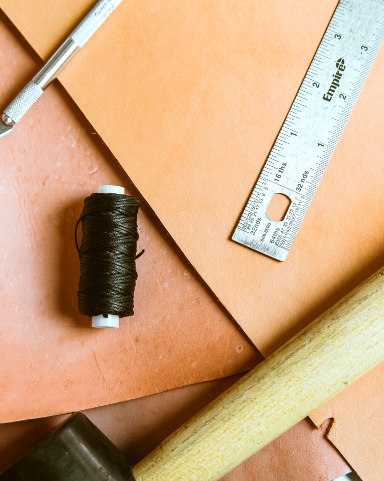 closeup photo of ruler and thread