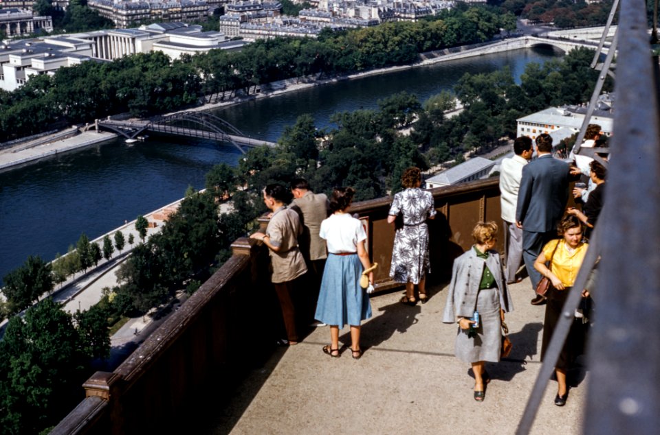 people standing on terrace with view of river