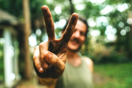 person doing peace sign photo