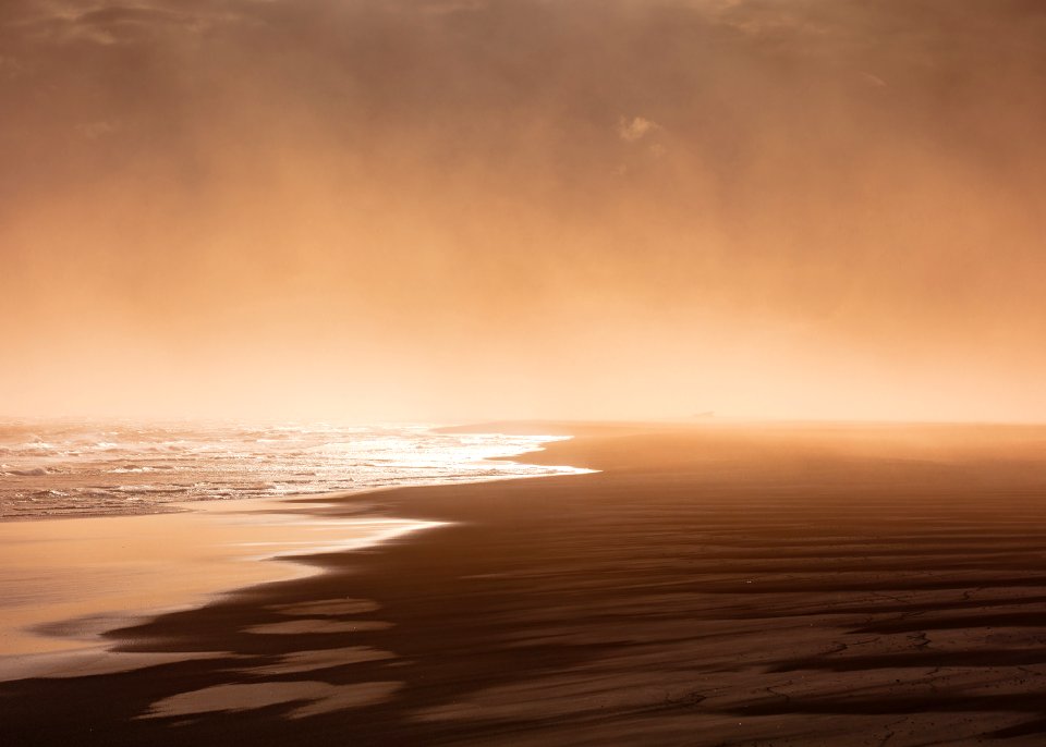 body of water across sands photo