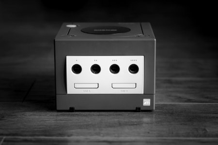 white and black Nintendo GameCube on gray surface photo