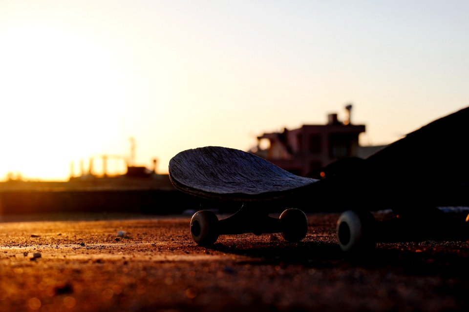 close-up photo of gray skateboard deck