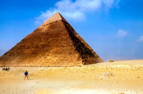 man standing near Pyramid Giza during daytime photo