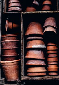 closeup photo of stack of brown clay pot lot photo