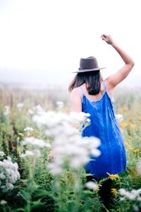 woman walking a flower field photo