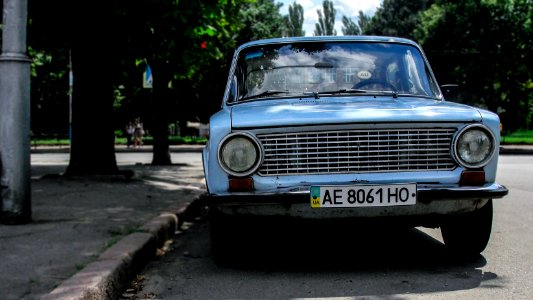 classic blue car on road