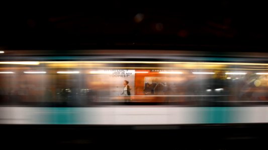 time lapse photo of woman inside a train photo
