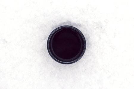 round black container on top of white surface photo