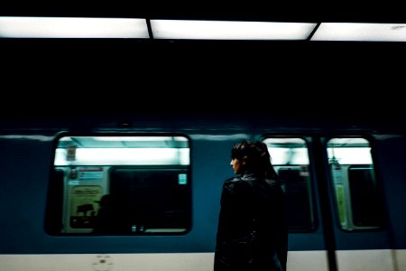 woman standing near closed train door photo