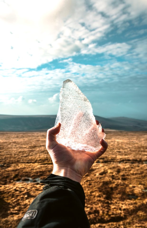 person holding ice during day time