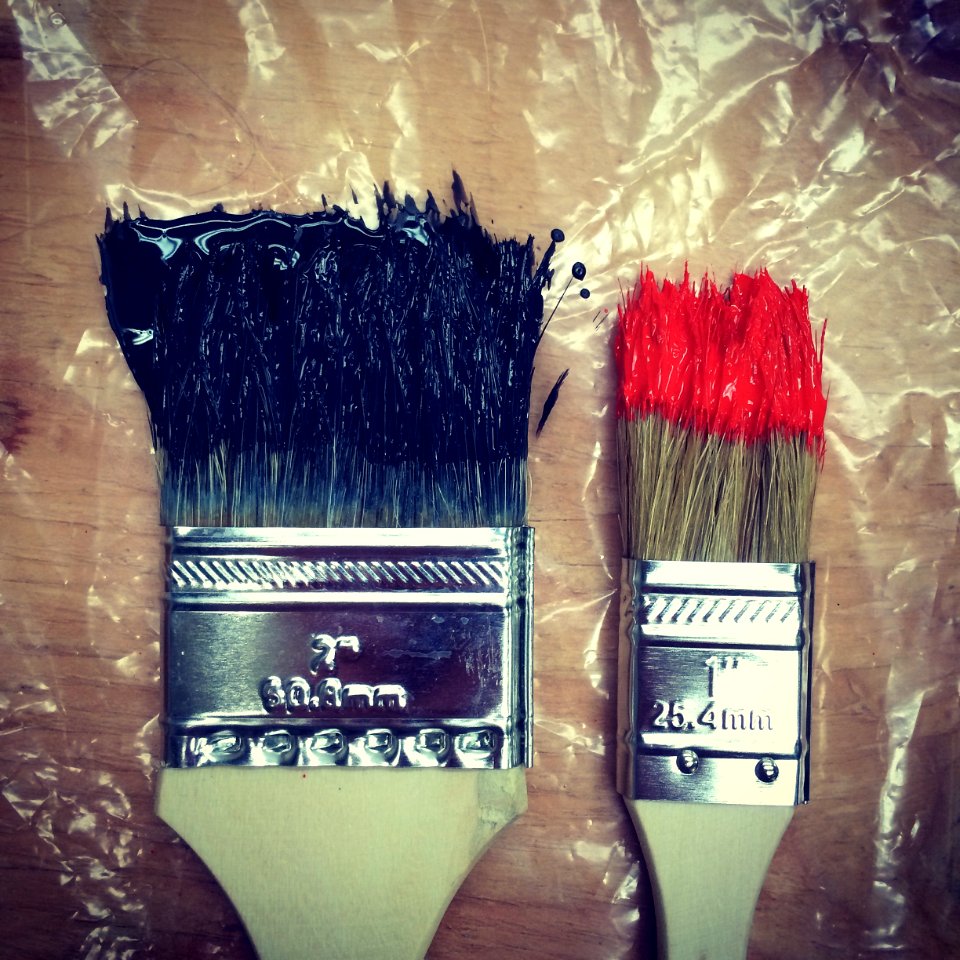 two paint brush on tables photo