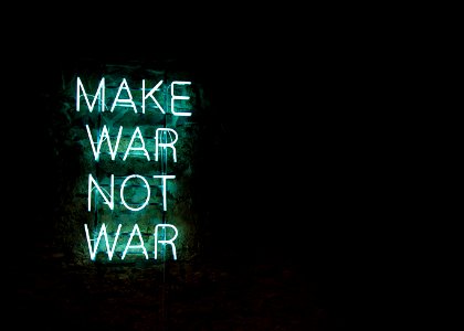 green make war not war LED signage photo