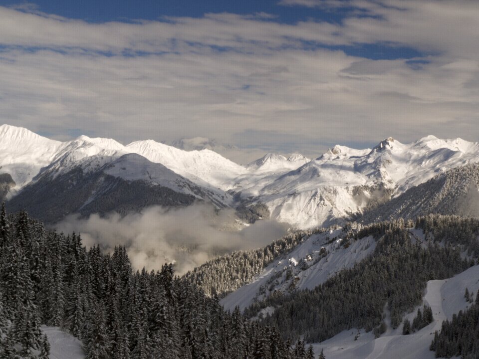 Mountain landscape slopes clouds