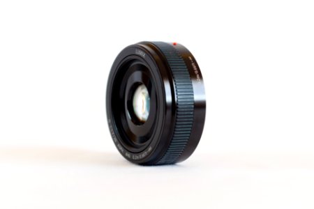black camera lens on white surface photo