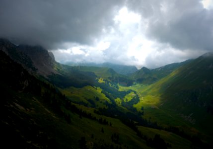 green mountains under cloudy sky photo