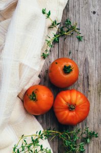 three orange tomato fruits photo
