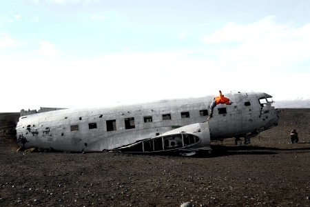 person doing back flip on wrecked plane