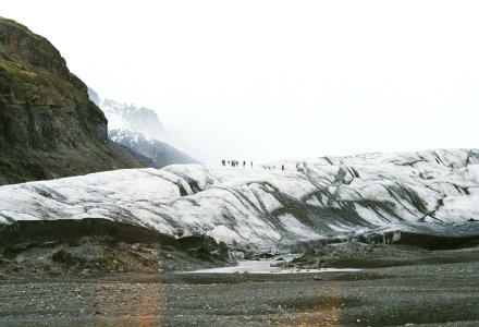 people standing on snow covered mountains during daytime photo