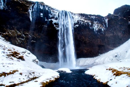 low-angle photography of waterfalls during winter photo