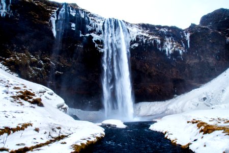 low-angle photography of waterfalls during winter