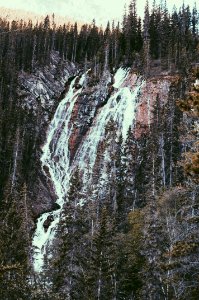 waterfalls surrounded with trees at daytime photo