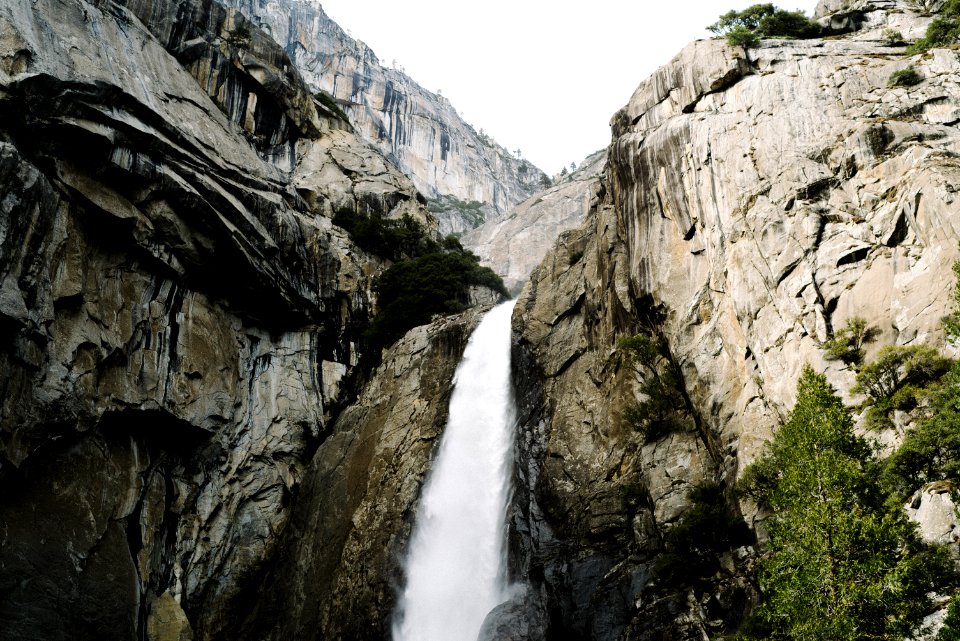 waterfalls between rocky mountain during daytime