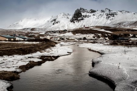 field covered with about to melt snow photo