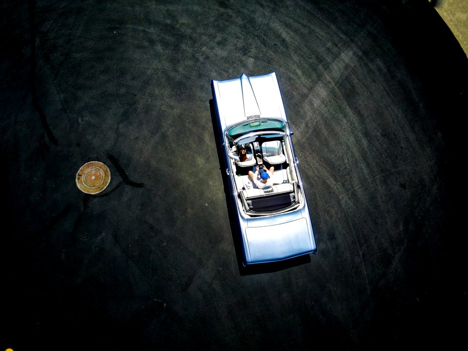 toy car near coin on table top
