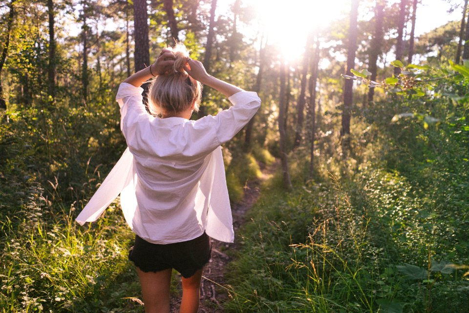 woman standing on the forest at daytime