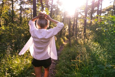 woman standing on the forest at daytime
