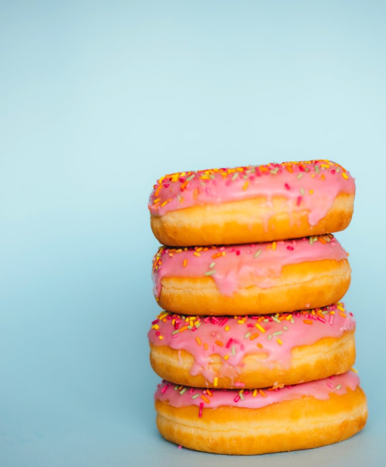four donuts with sprinkles